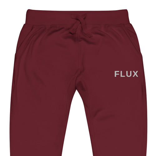 Close-up of FLX AWAY Maroon fleece joggers with solid white FLUX embroidery at the wearer-left hip.