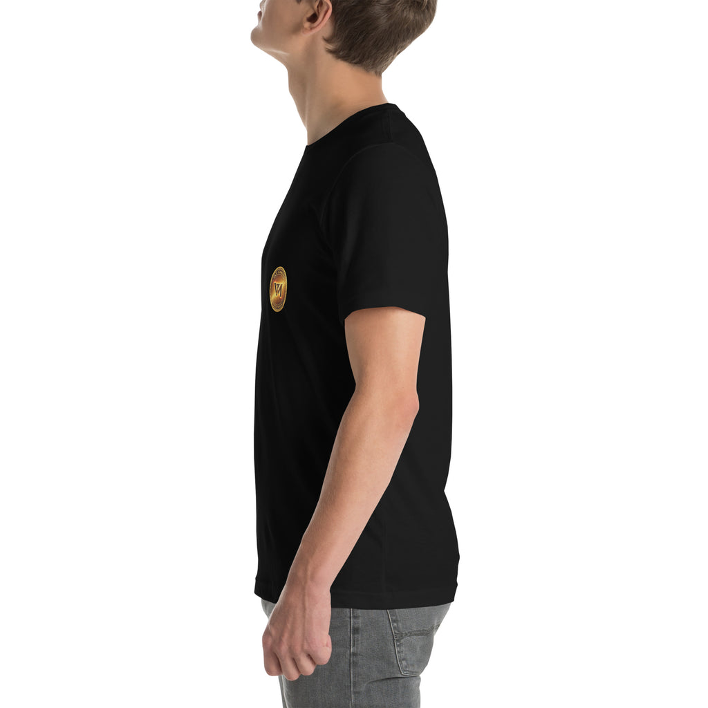 Left-side model view of the black FLX V-Money Coin Tee, with the small gold-coloured chest coin partly visible.